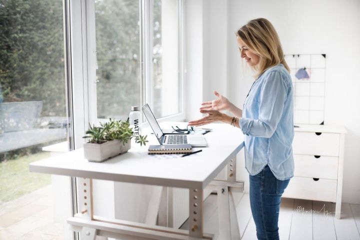 Woman Working at Ergonomic Standing Desk