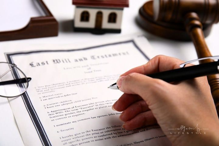 Woman Signing Last Will and Testament at White Table, Closeup