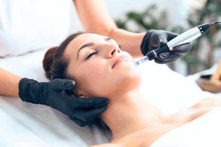 Cosmetologist Making Mesotherapy Injection with Dermapen on Face