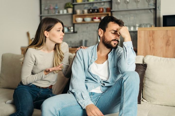 Young angry man having relationship difficulties with his wife