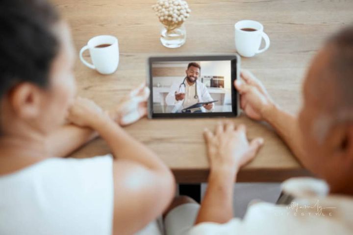 senior couple on telehealth call with doctor on tablet