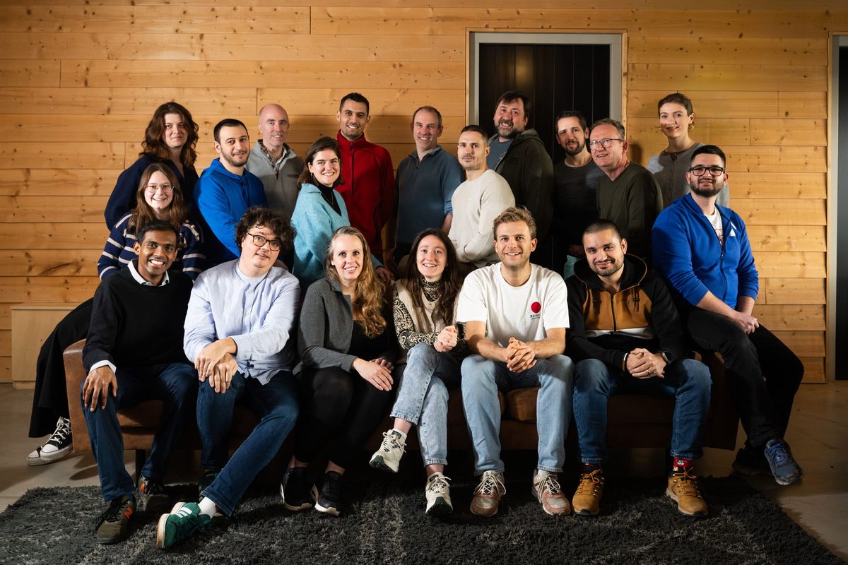 A team photo of the Alkemio team, from their 2026 company off-site. A few members are sitting, and a few are standing behind. 