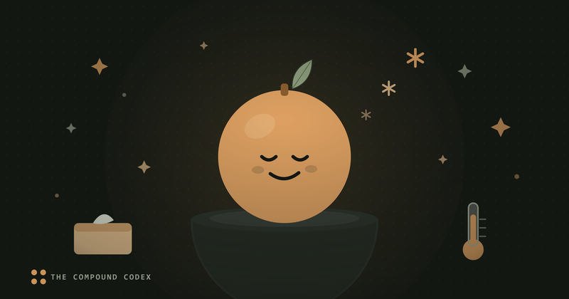 A friendly orange in a bowl, beside a tissue box and a thermometer