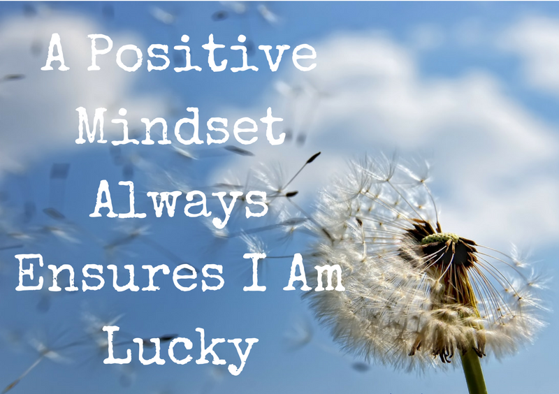 Quote graphic with a dandelion against a blue sky about positive mindset and luck, supporting Facebook search optimization, content consistency, and make money from home growth.