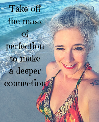 Woman smiling confidently by the ocean with text “Take off the mask of perfection to make a deeper connection,” symbolizing authenticity, inner strength and confidence in online business.