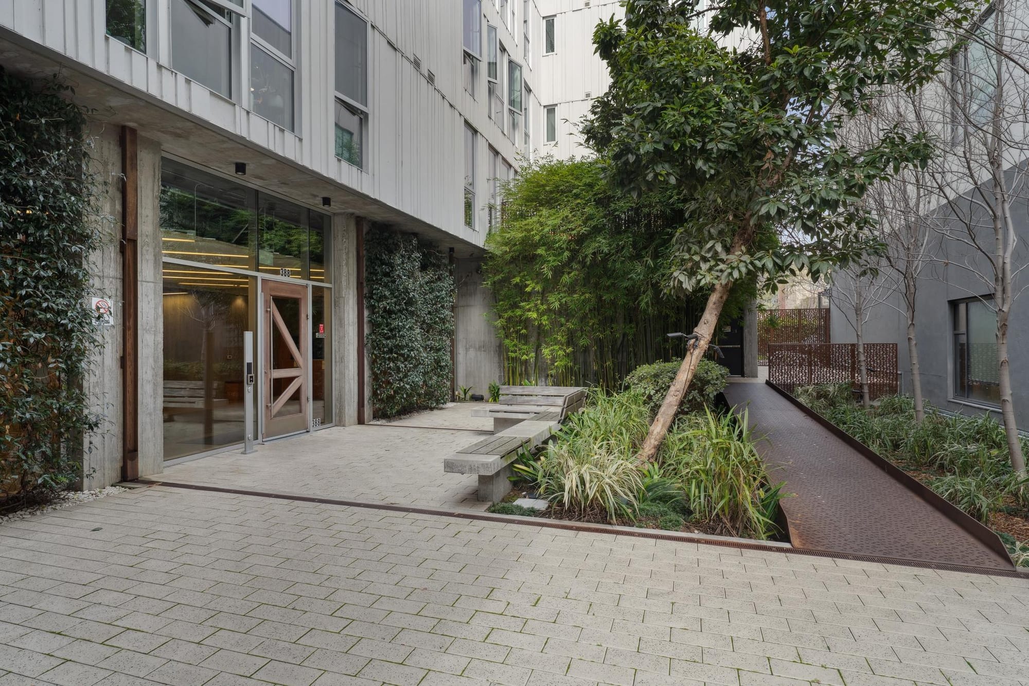 Landscaped courtyard walkway at 388 Fulton