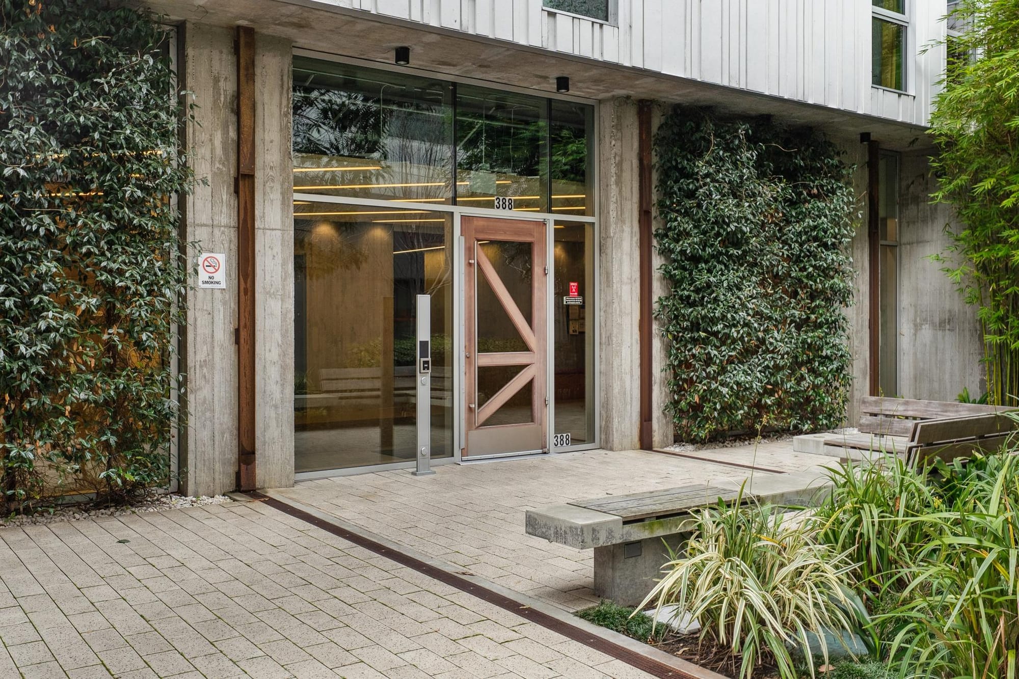 Glass lobby entrance off the courtyard at 388 Fulton