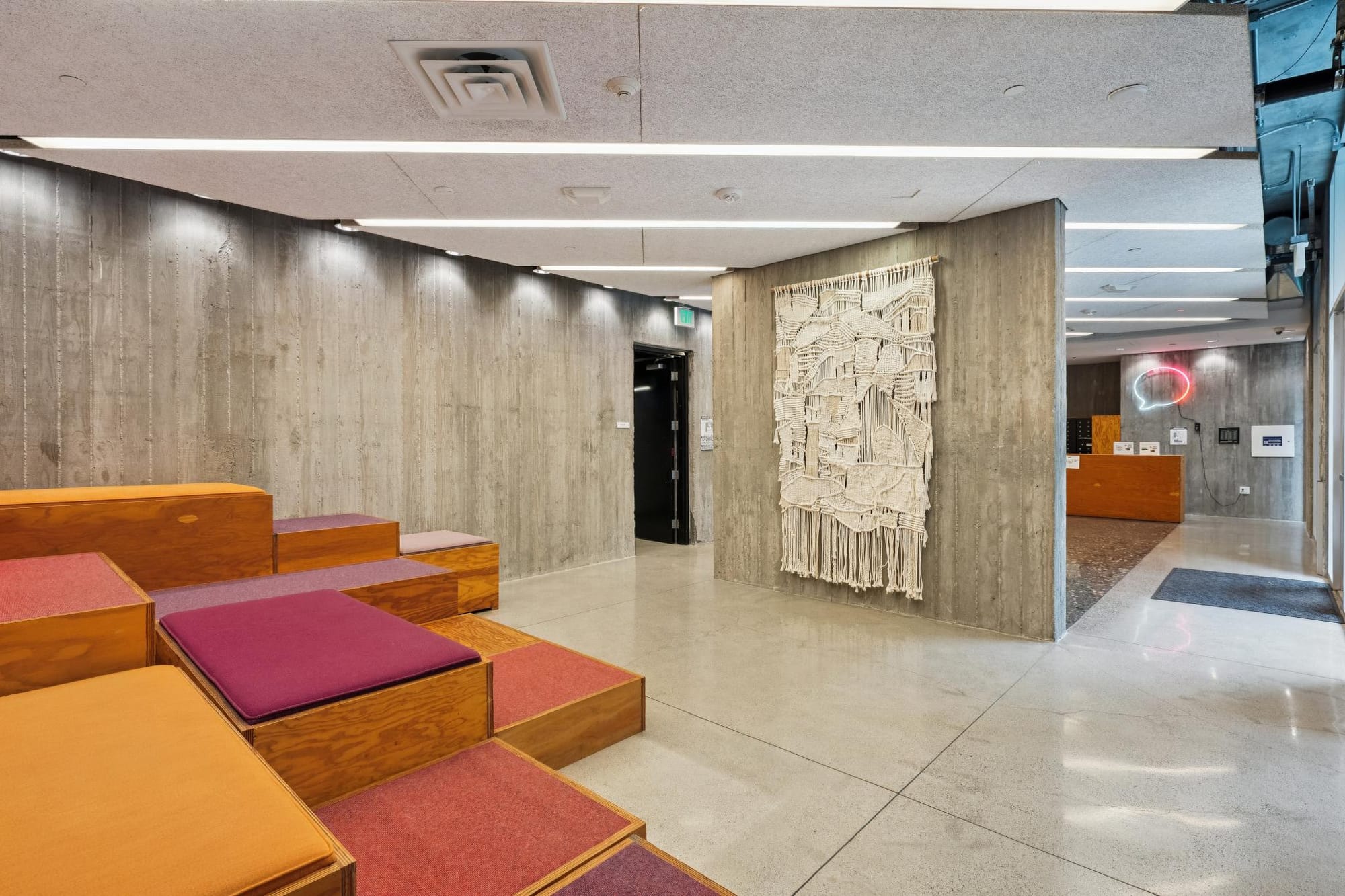 Lobby lounge and art wall at 388 Fulton