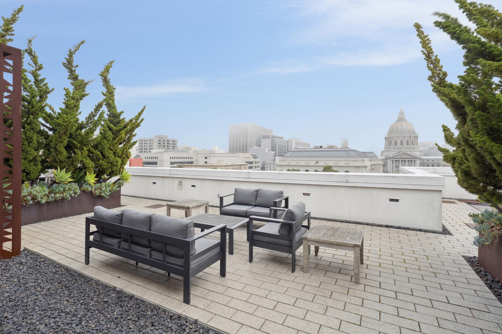 Rooftop sofas and planters at 388 Fulton