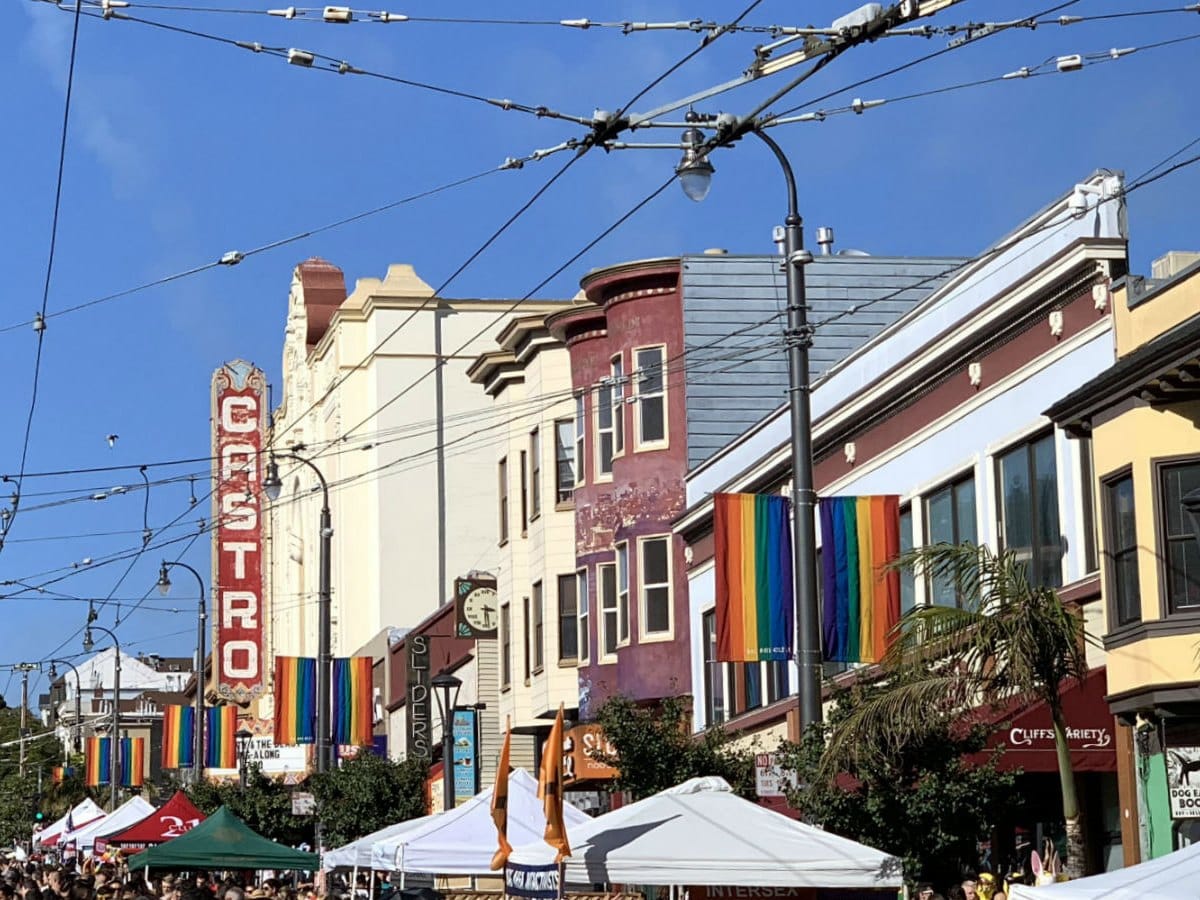 The Castro Theatre sign and rainbow flags above Castro Street