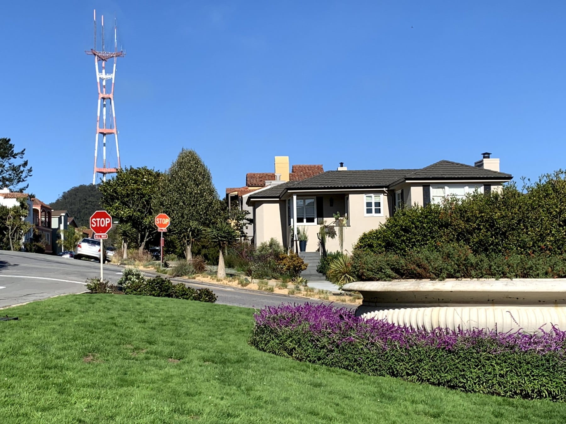 Sutro Tower rising above a Forest Hill home and garden