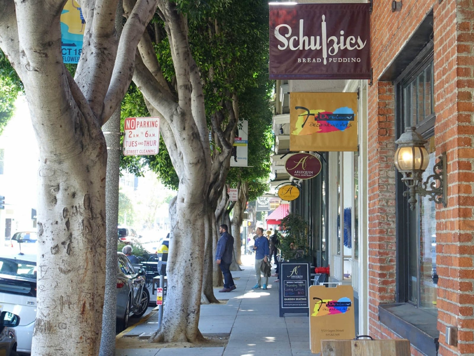 Shops under street trees on Hayes Street