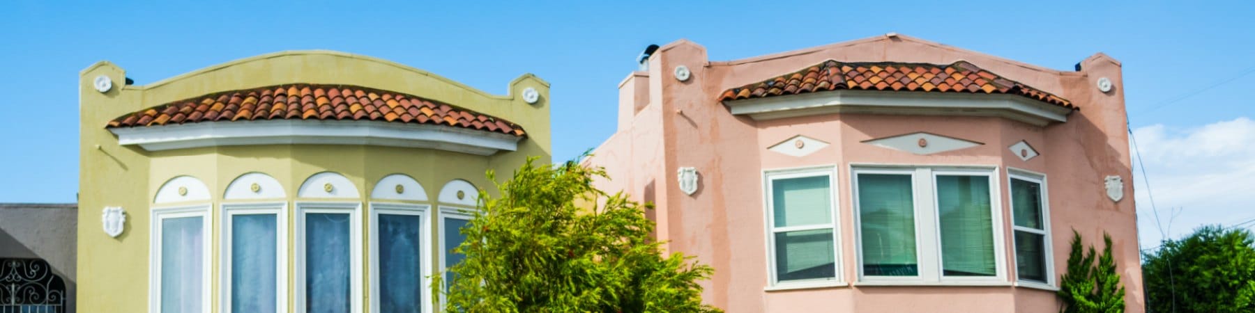 Tile roofs and bay windows on Richmond stucco houses
