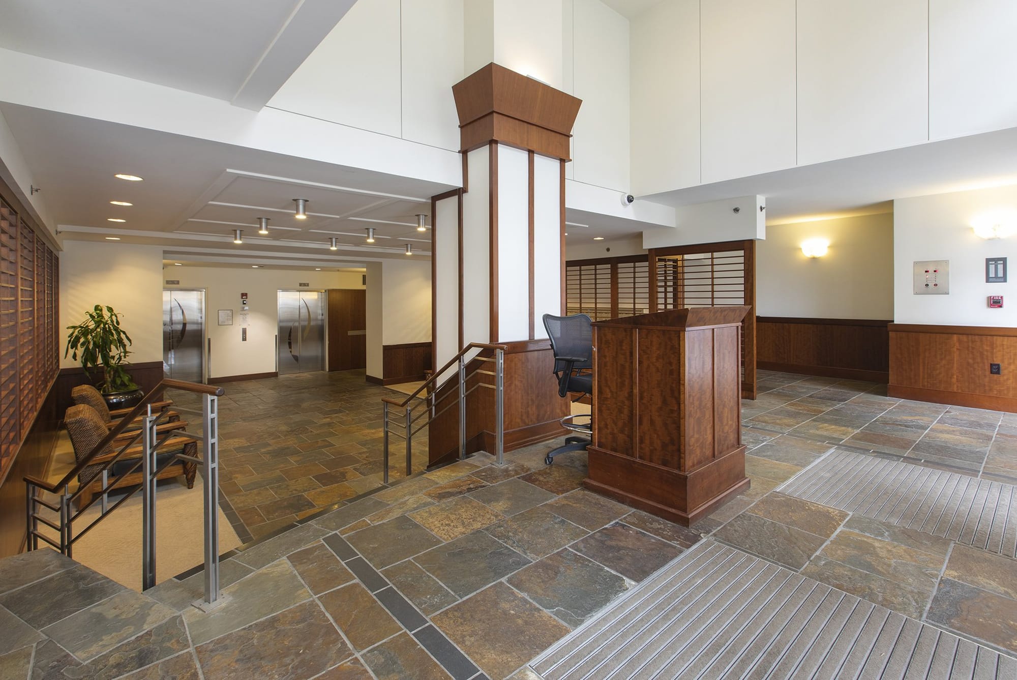 A Pacific Place lobby with slate floors and wood paneling