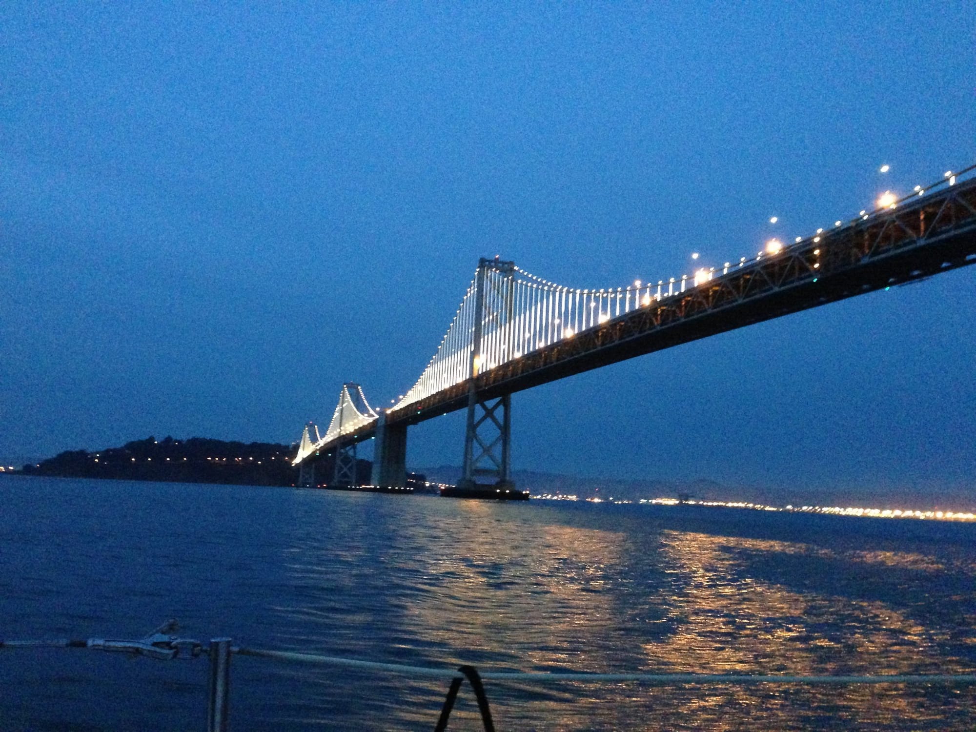 The Bay Bridge lit up at dusk from South Beach