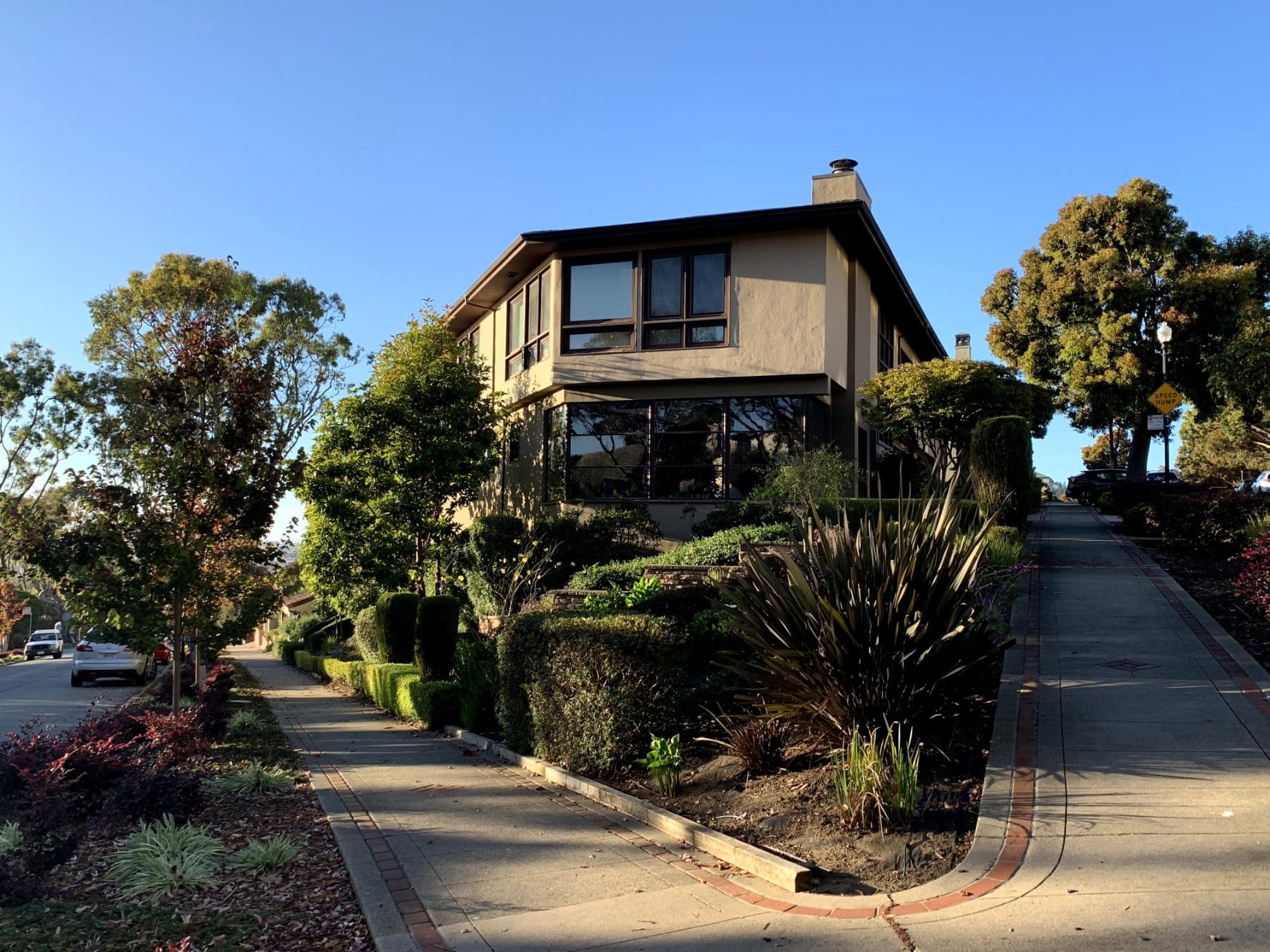 A large home behind a landscaped garden in St. Francis Wood
