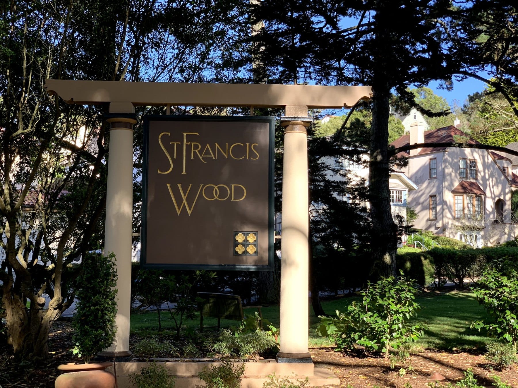 The St. Francis Wood entrance sign framed by columns