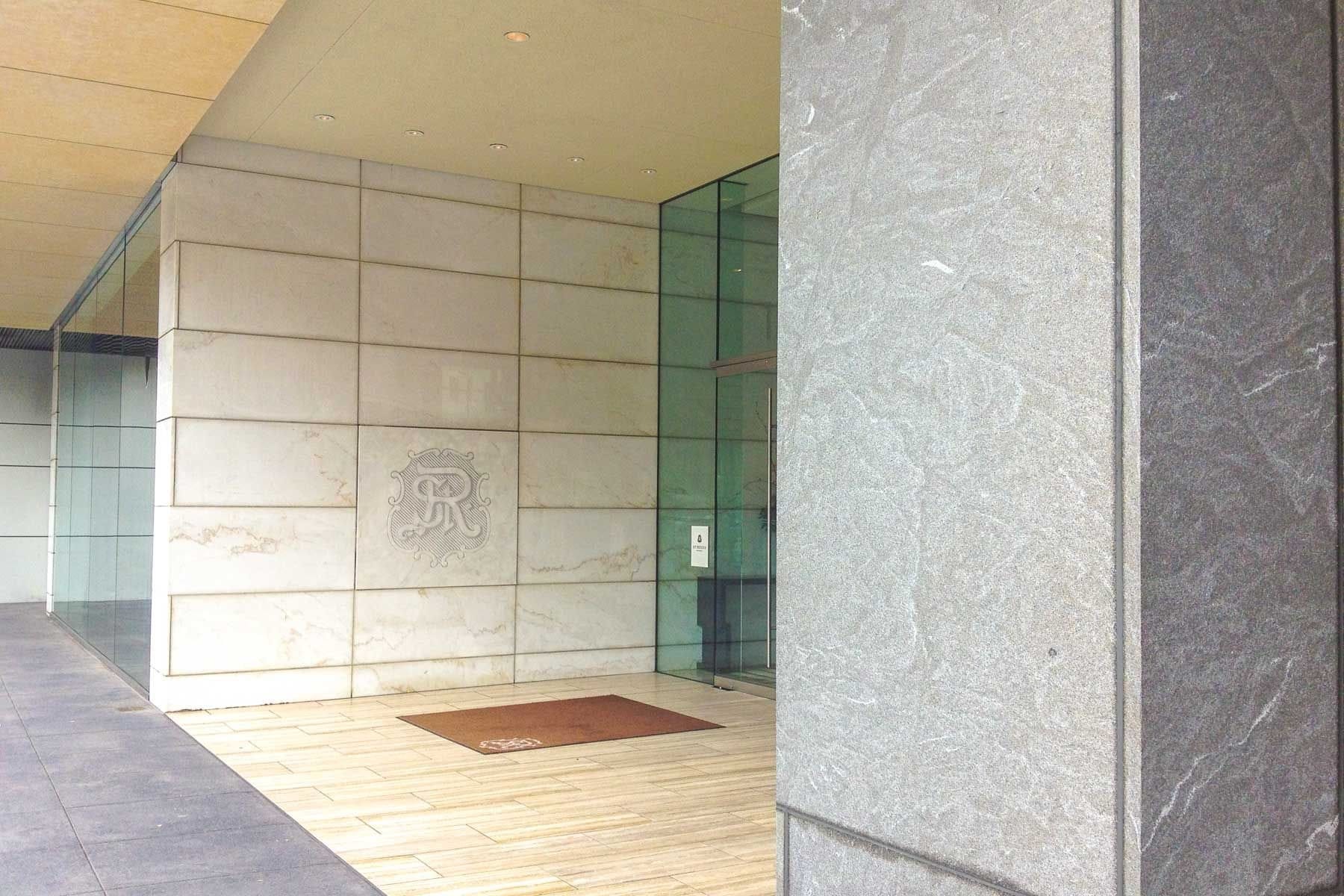 Stone-clad entry at the St. Regis Residences