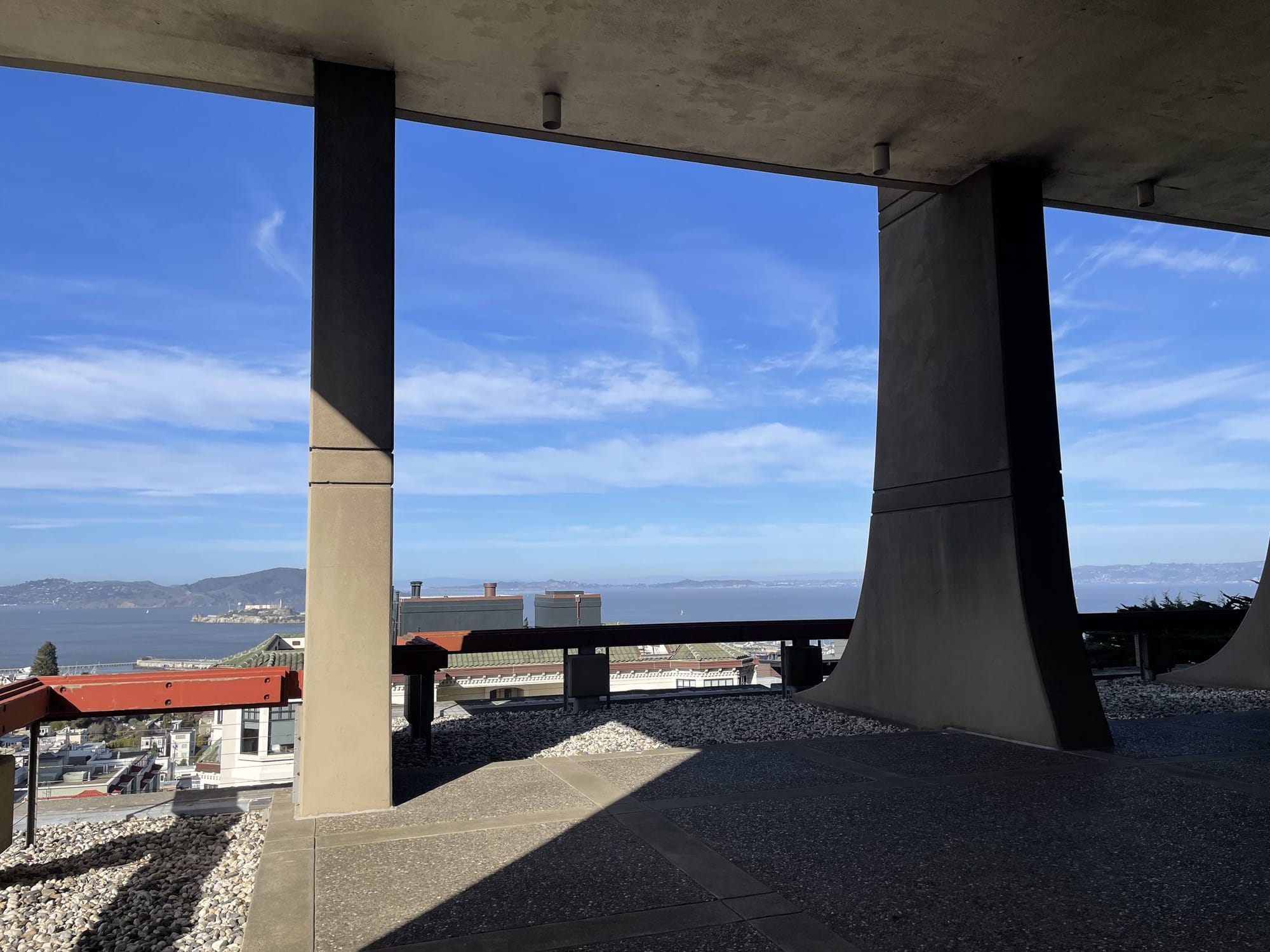 The common terrace at The Summit, framed by the building’s concrete piers
