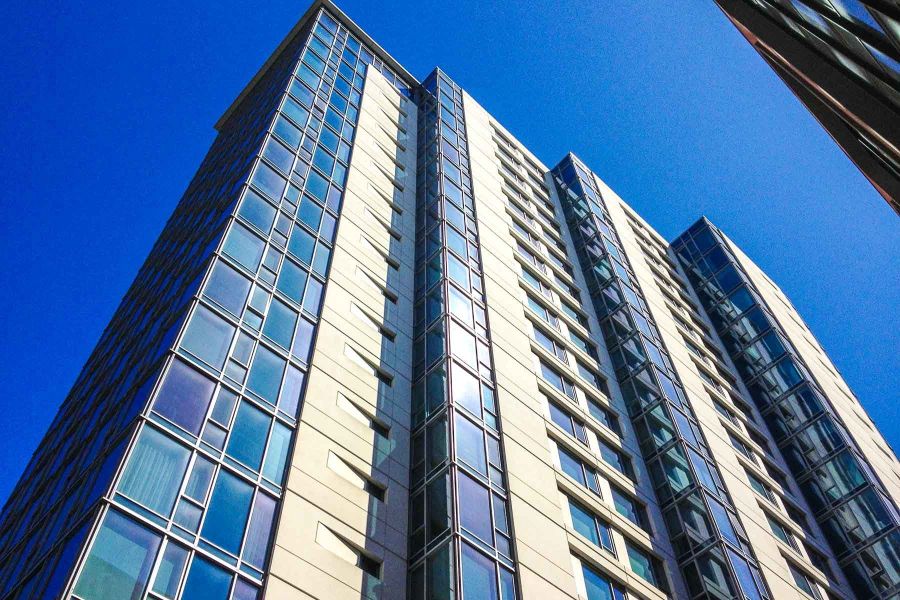 The blue glass facade of the Blu tower at 631 Folsom Street