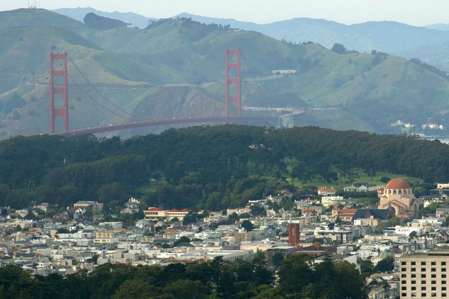 The Golden Gate Bridge above Inner Richmond rooftops