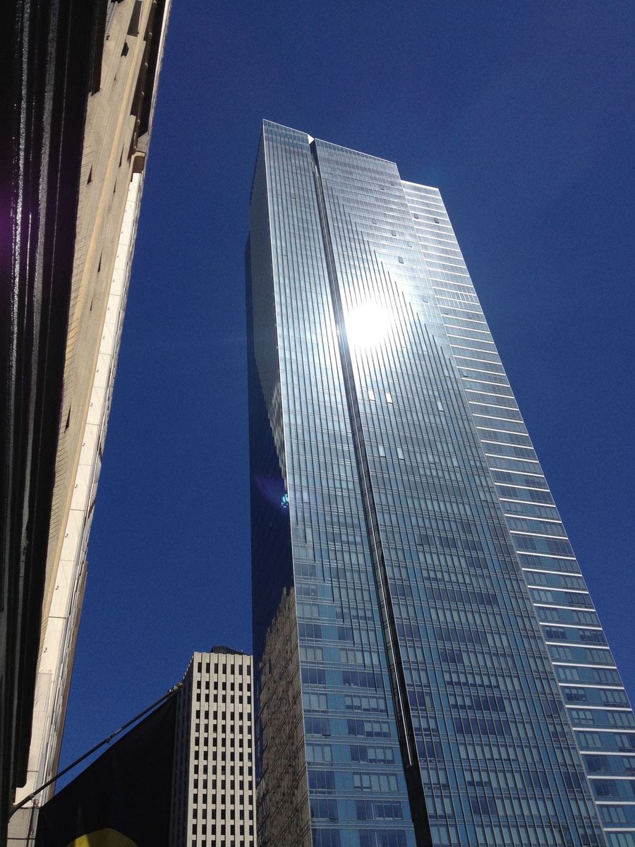 The glass Millennium Tower rising above Mission Street in San Francisco