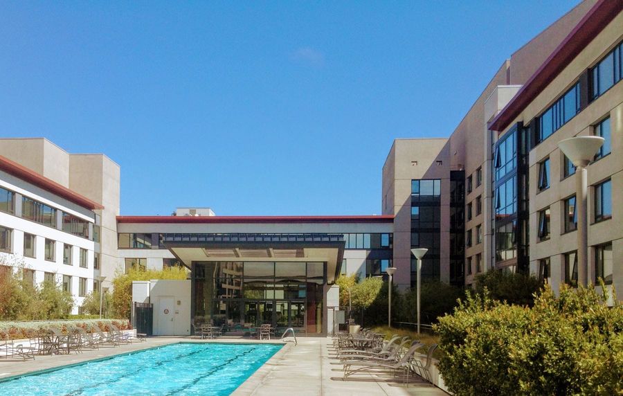 The outdoor pool and clubhouse at The Beacon on King Street