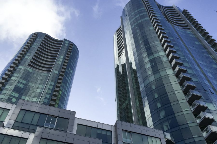 The Infinity’s two curved glass towers at 301 Main and 338 Spear streets
