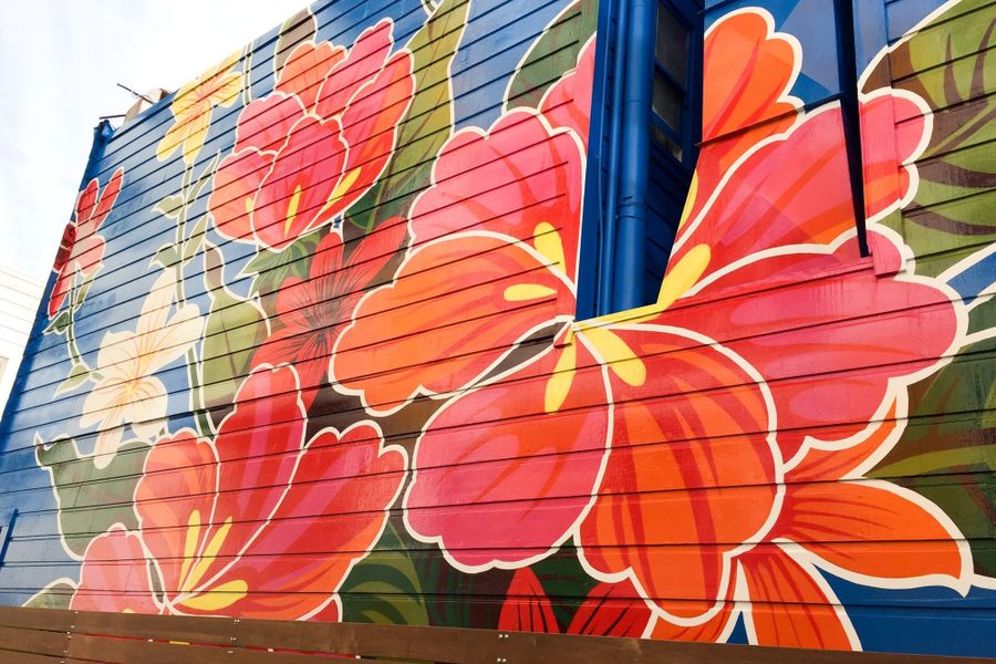 A large flower mural on a Mission District building