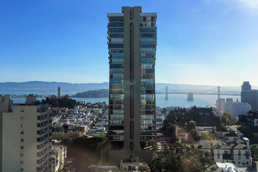 The Summit tower on Russian Hill with the Bay Bridge and the bay behind it