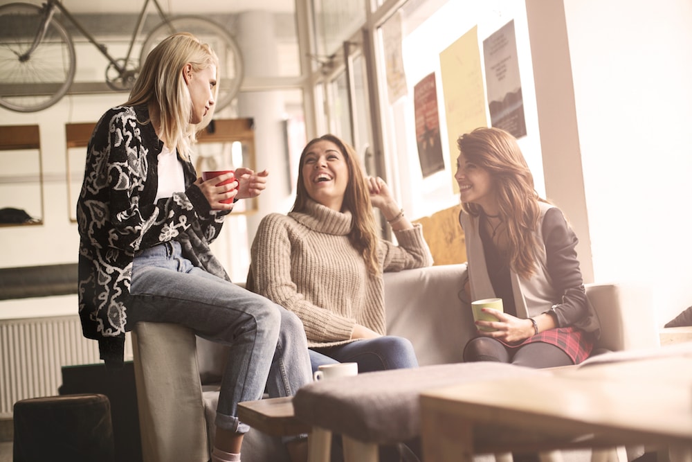 friends talking together in a coffee shop