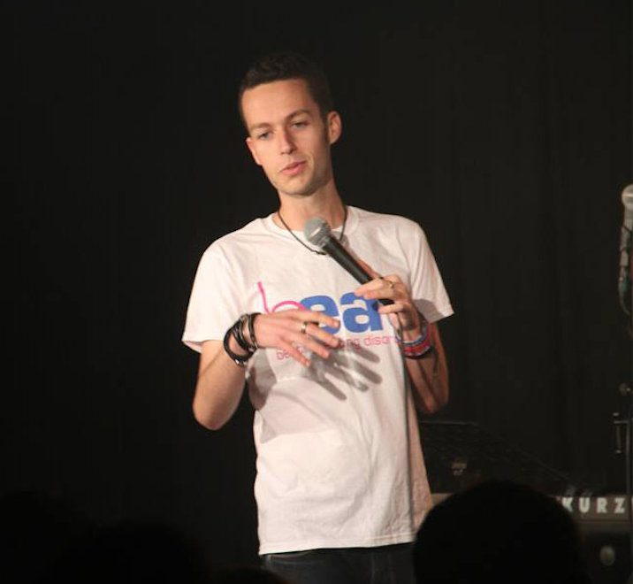 This is photo of Dave performing his stand up routine for Beat