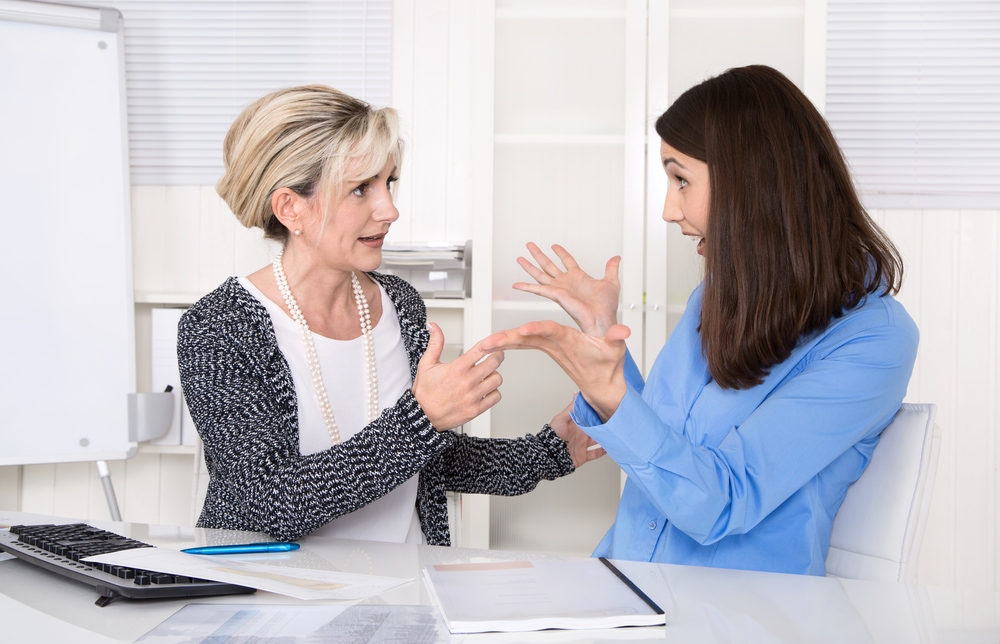This is photo of people at work arguing