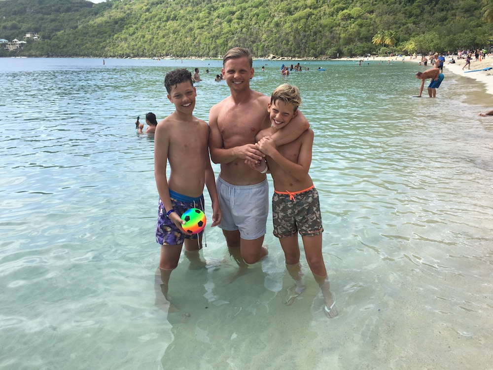 This is a photo of Jeff with his two sons on a beach