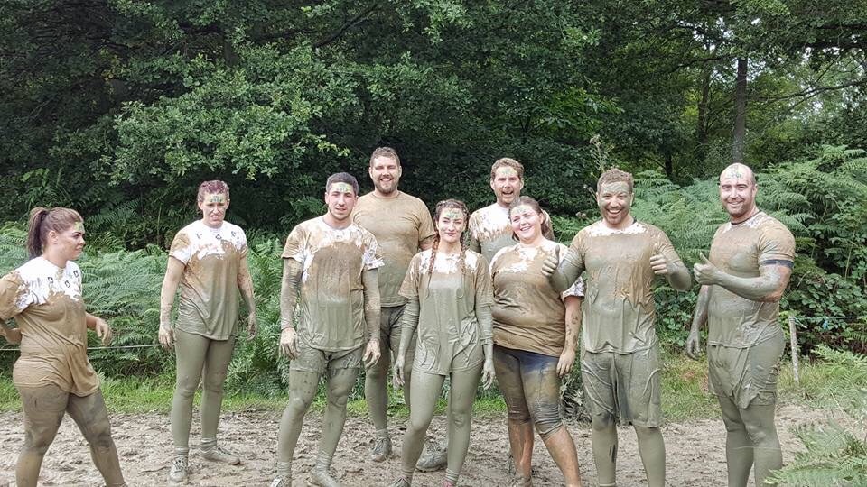 This is a photo of James' work team at an event to raise money