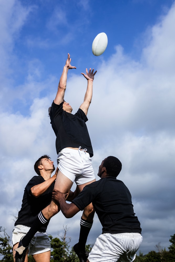 men playing rugby