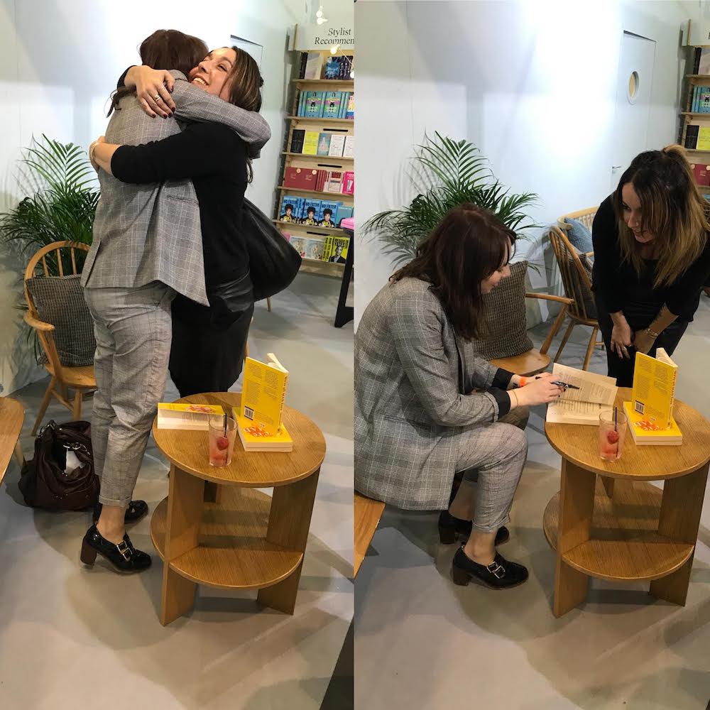 Claire signing her books