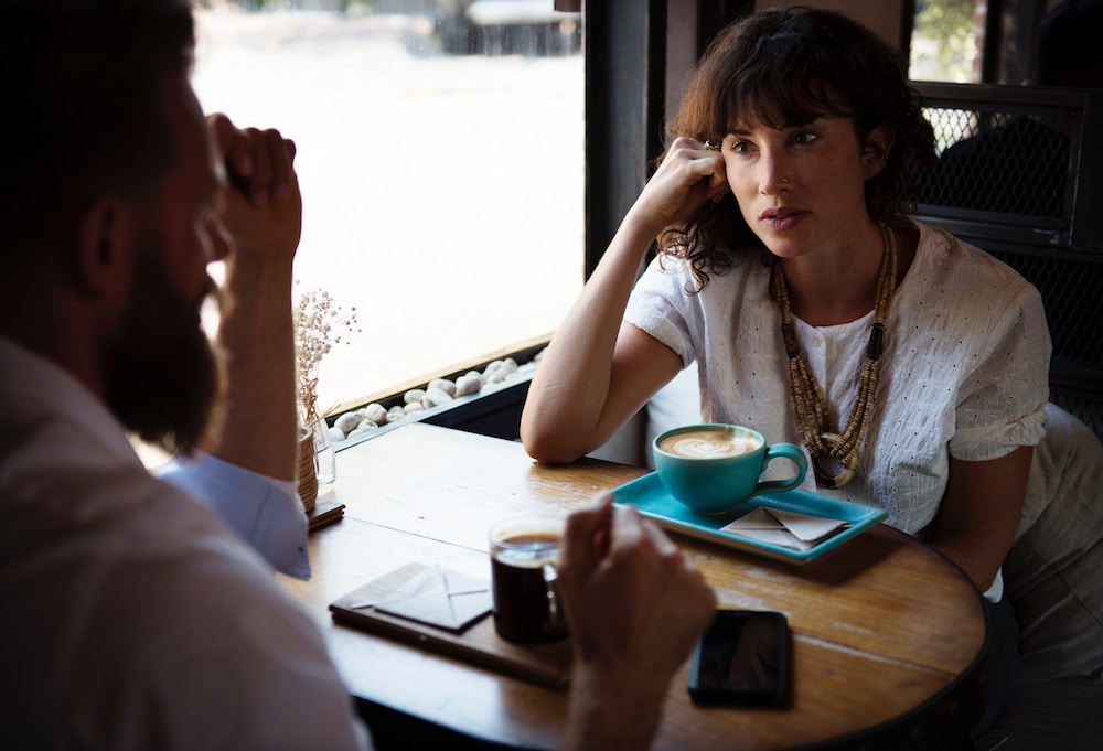 man and woman having a meeting