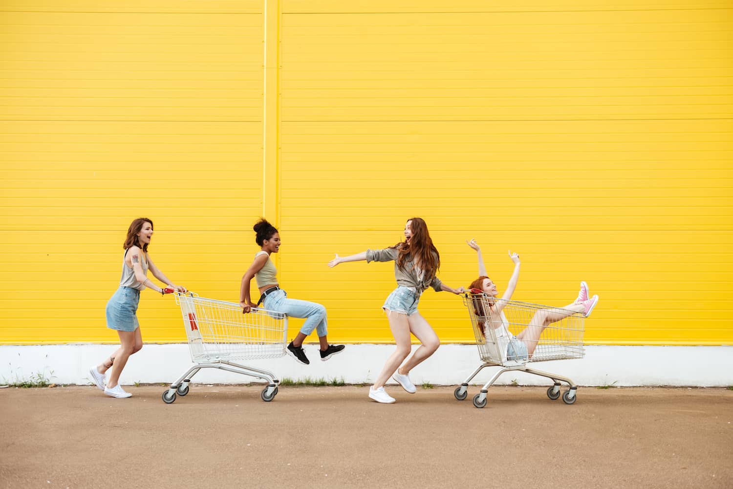 female-friends-yellow-background-min