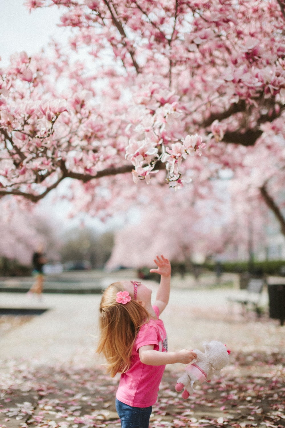 girl looking at tree