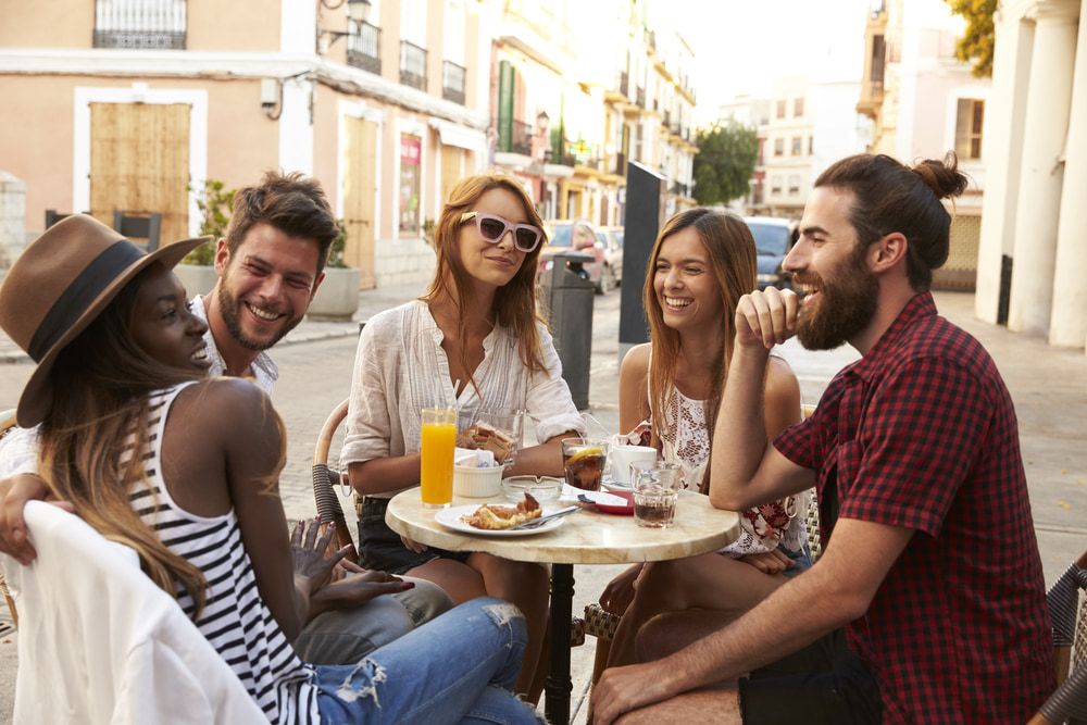Group of friends sitting around a table