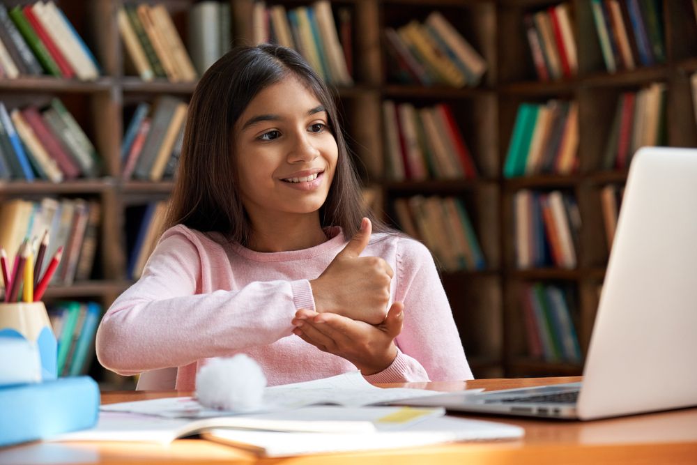 Young girl learning sign language