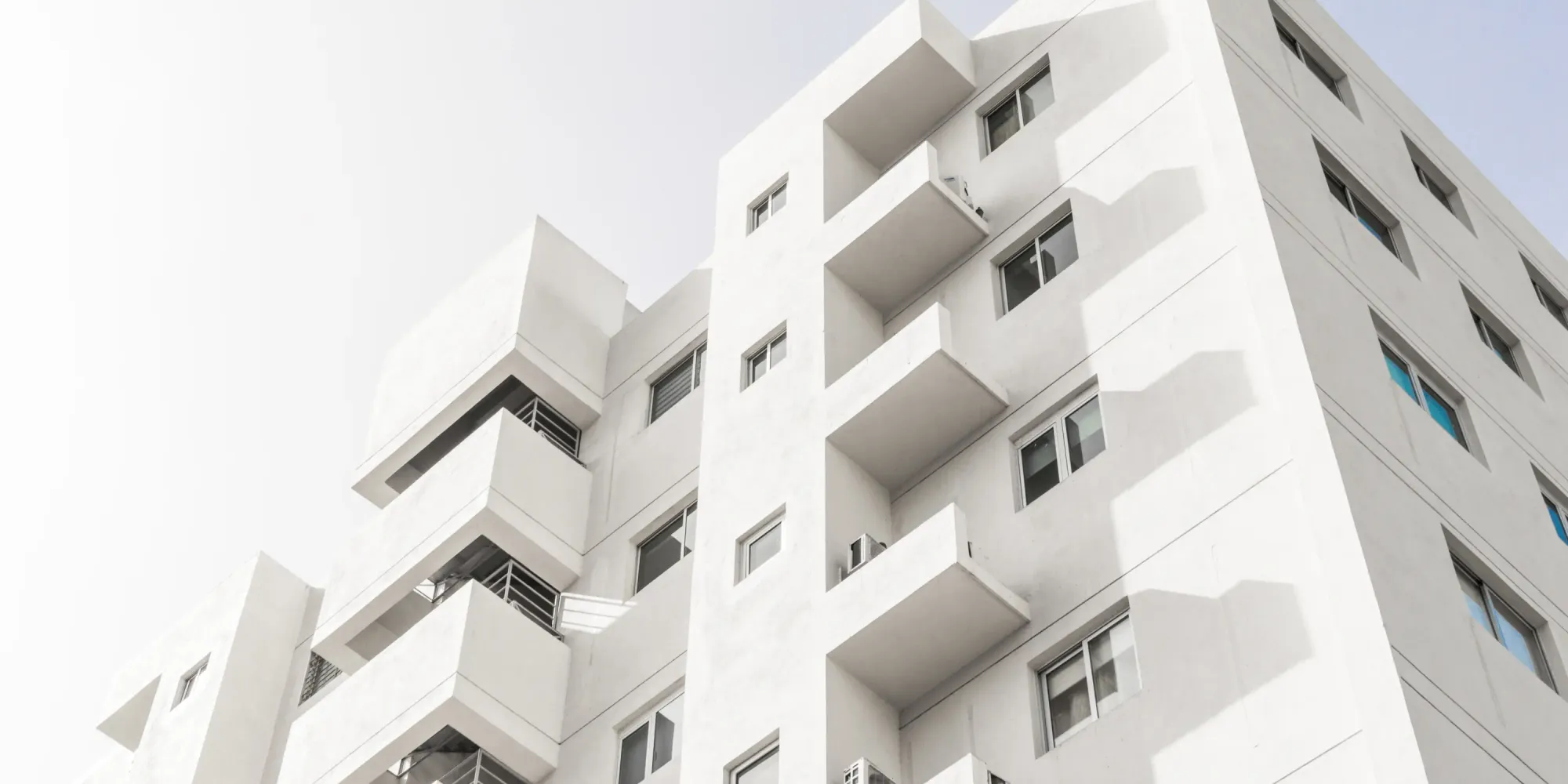 Contemporary urban skyline with a high-rise building — symbolizing growing global interest in tokenized property assets.