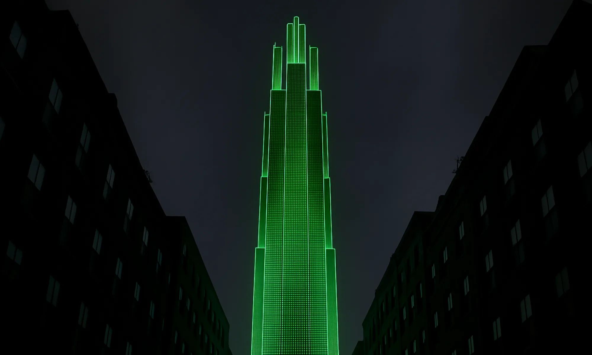Dark night scene: a tall, tiered skyscraper outlined in vivid green light rises between shadowed mid-rise buildings under a cloudy sky.