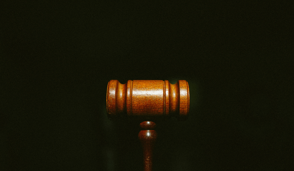 Wooden judge gavel on black background
