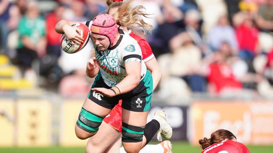 Ireland's Dorothy Wall is tackled by Wales Lleucu George during the Guinness Women's Six Nations match at Rodney Parade