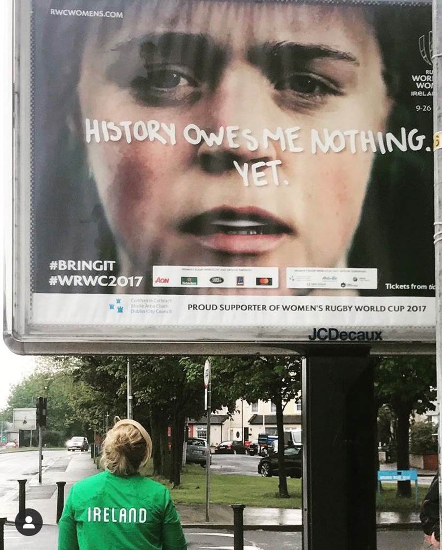 A person standing on a sidewalk looking at a billboard

AI-generated content may be incorrect.