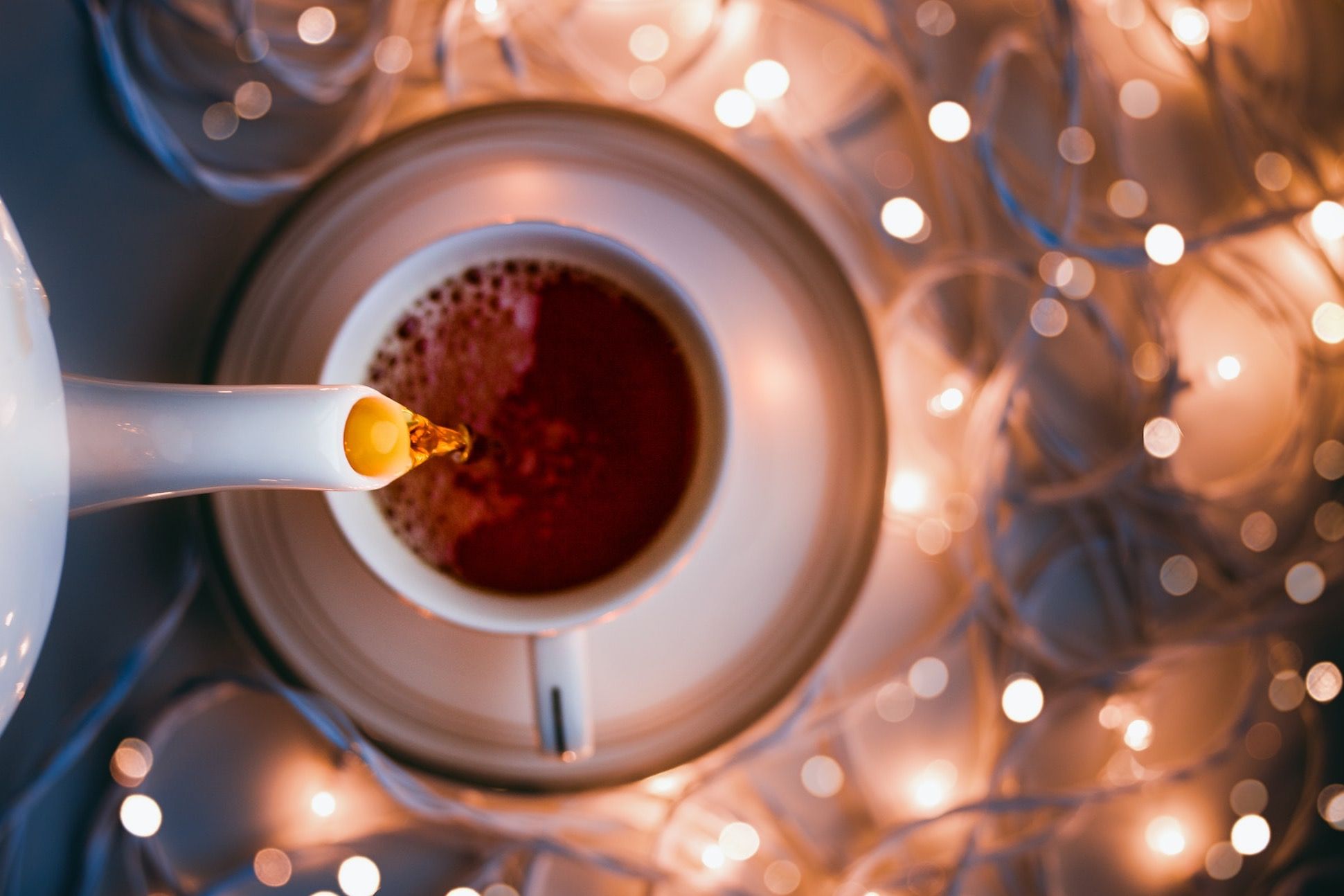white ceramic mug on clear glass table