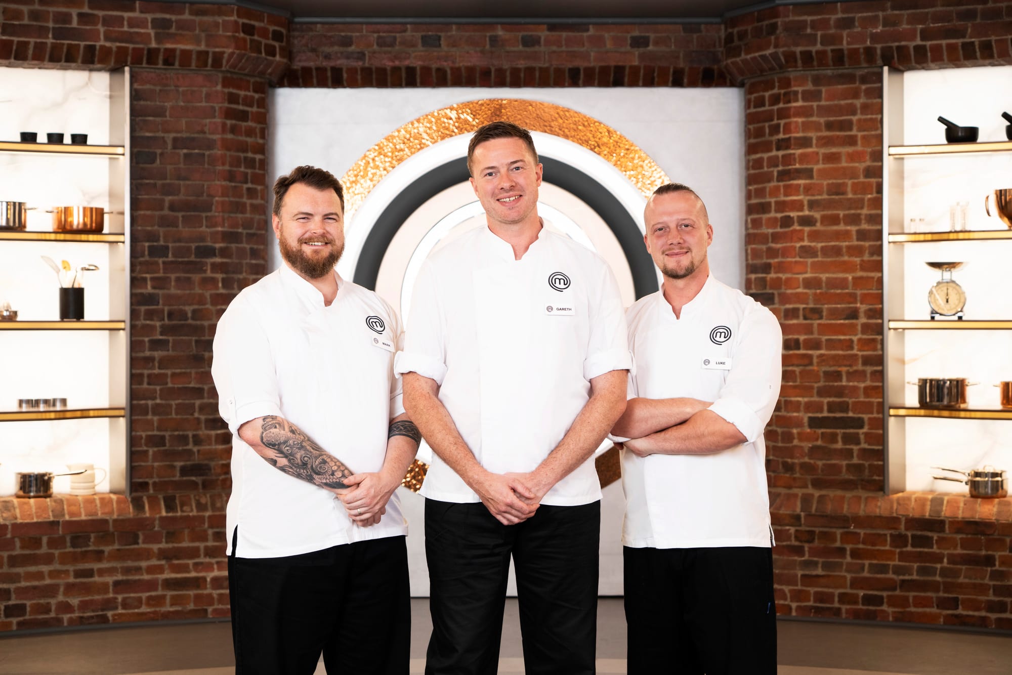 MasterChef: The Professionals finalists in the studio wearing white chef coats