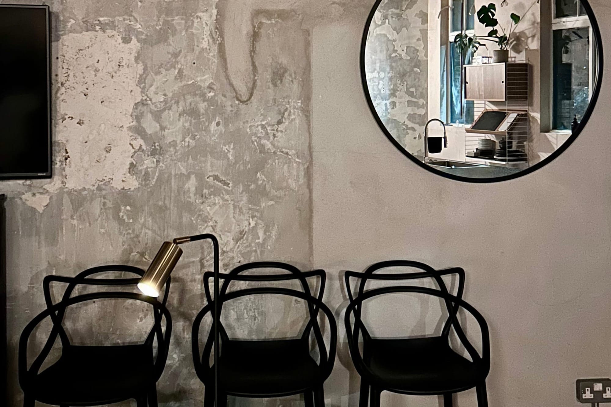 Three chairs and a mirror